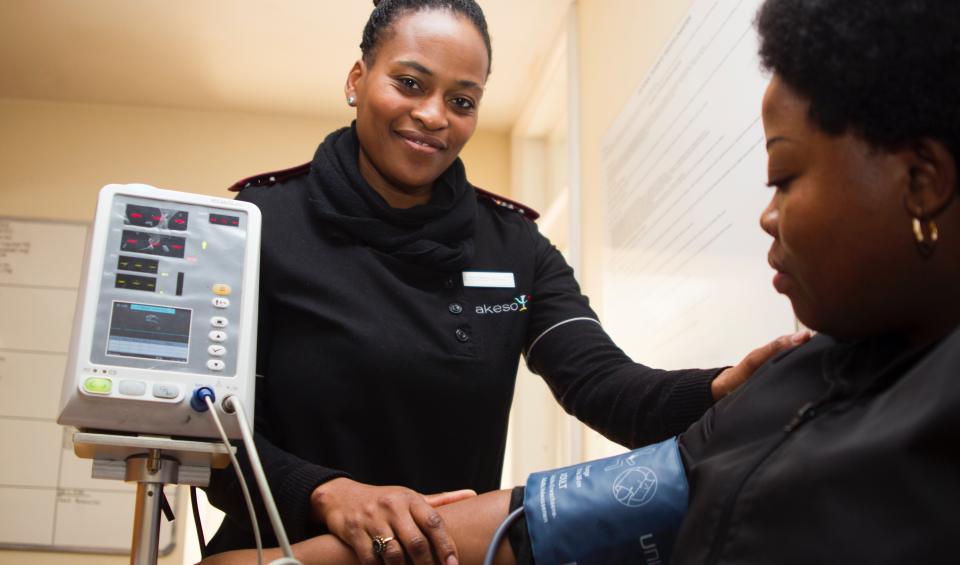 Nurse taking blood pressure. Photo by Hush Naidoo on Unsplash