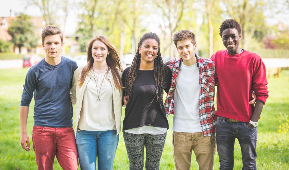 Five youth standing